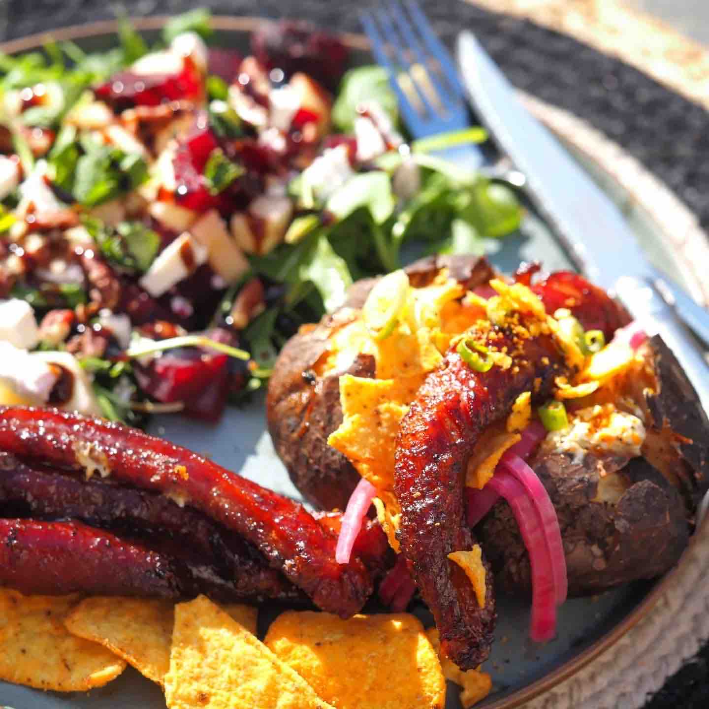 Iberico ribfingers with a jacket potato and a roasted beetroot